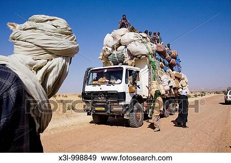 Stock Photo - Fully loaded truck Emigrants come back from Libya. Fotosearch