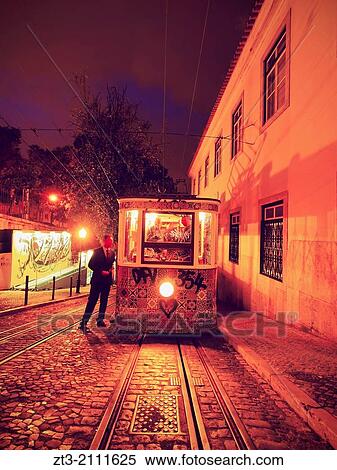 Funicular going up the Calcada da Gloria street in Lisbon, Portugal. View Large Photo Image Stock Photography - Funicular going up the Calcada da Gloria street in Lisbon, Portugal.. Fotosearch