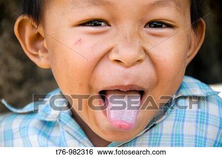 funny boy with tongue out in Siem Reap Cambodia View Large Photo Image Stock Photograph - funny boy with tongue out in Siem Reap Cambodia. Fotosearch
