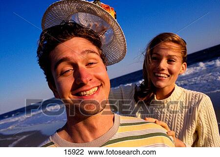 Stock Image - Funny couple at the beach. Fotosearch