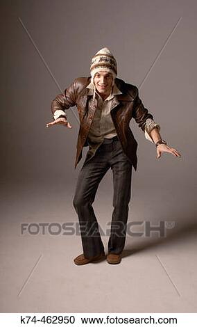 funny image of young man in leather jacket and silly hat View Large Photo Image Stock Image - funny image of young man in leather jacket and silly hat. Fotosearch