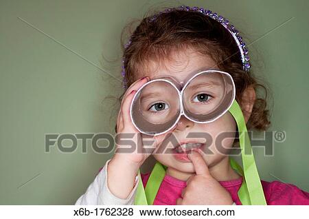 Funny portrait of a 3 year old girl View Large Photo Image Stock Photo - Funny portrait of a 3 year old girl. Fotosearch
