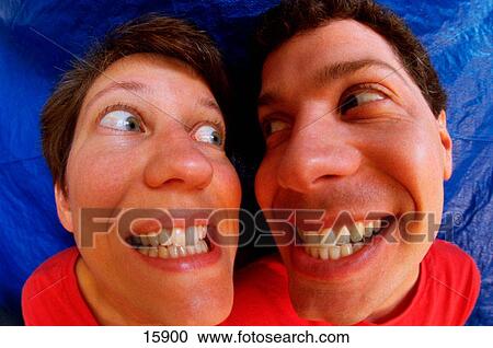 Funny portrait of couple grinning at each other View Large Photo Image Stock Image - Funny portrait of couple grinning at each other. Fotosearch