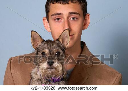 Funny portrait of dog and young teenage man View Large Photo Image Stock Photograph - Funny portrait of dog and young teenage man. Fotosearch