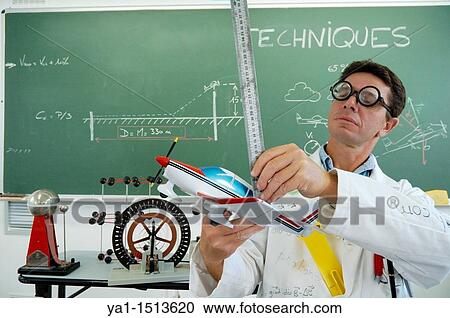 Funny school teacher explaining motorized flight with model plane View Large Photo Image Stock Image - Funny school teacher explaining motorized flight with model plane. Fotosearch