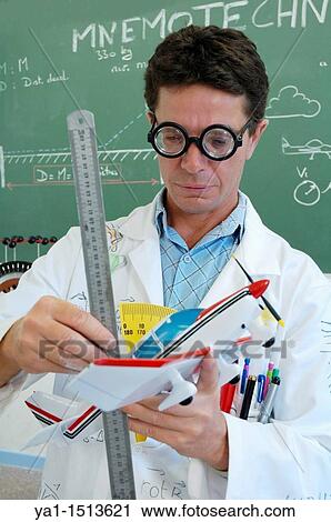 Funny school teacher explaining motorized flight with model plane View Large Photo Image Stock Image - Funny school teacher explaining motorized flight with model plane. Fotosearch