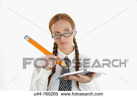 Stock Photography - Funny secretary writing a notebook with big pencil. Fotosearch