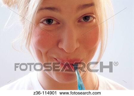 Stock Image - Funny woman brushing teeth. Fotosearch
