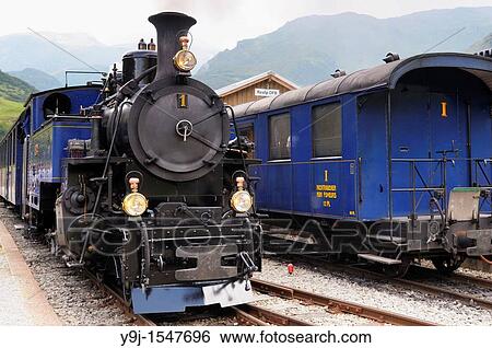 Furka cogwheel steam railway at Realp station Switzerland, Western Europe, Grimsel-/Furka region, Uri View Large Photo Image Stock Photograph - Furka cogwheel steam railway at Realp station Switzerland, Western Europe, Grimsel-/Furka region, Uri. Fotosearch
