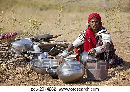 Gadaria old woman cleaning utensils, Gadaria tribe, Madhya Pradesh, India. View Large Photo Image Stock Image - Gadaria old woman cleaning utensils, Gadaria tribe, Madhya Pradesh, India.. Fotosearch
