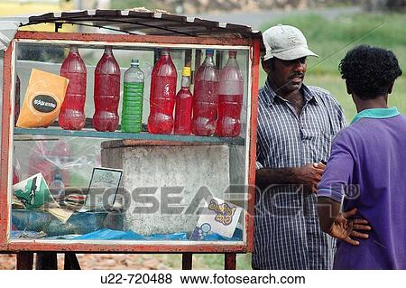 Stock Photo - Galle Sri Lanka: gasoline in bottles, sold along the street. Fotosearch