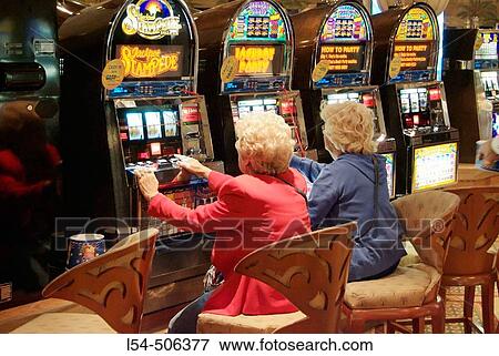 Gambling at slot machines aboard the Cruis Ship Carnival Fantasy traveling to the Islands of Nassau, St. Maarten, Martin, and St. Thomas Virgin Islands from Port Canaveral, Florida View Large Photo Image Stock Photo - Gambling at slot machines aboard the Cruis Ship Carnival Fantasy traveling to the Islands of Nassau, St. Maarten, Martin, and St. Thomas Virgin Islands from Port Canaveral, Florida. Fotosearch