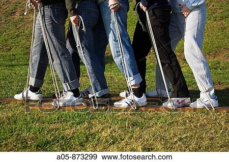 Stock Photo - Games to promote improved teamwork and job performance. Fotosearch