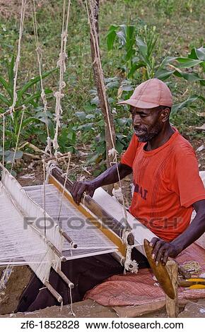 Gamo Gofa Ethiopia Africa man weaving in Gamo Tribe traditional methods weave scarf 11 View Large Photo Image Stock Photo - Gamo Gofa Ethiopia Africa man weaving in Gamo Tribe traditional methods weave scarf 11. Fotosearch