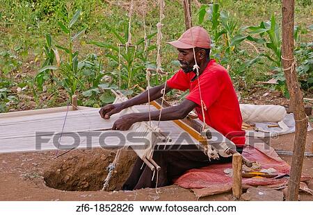 Gamo Gofa Ethiopia Africa man weaving in Gamo Tribe traditional methods weave scarf 11 View Large Photo Image Stock Photograph - Gamo Gofa Ethiopia Africa man weaving in Gamo Tribe traditional methods weave scarf 11. Fotosearch