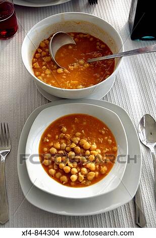 garbanzos con bacalao-men-alimentaci? n-gastronomia-cocido-gourmet-comida-potaje-platos-cubiertos-mesa-puesta. Asturias View Large Photo Image Picture - garbanzos con bacalao-men-alimentaci? n-gastronomia-cocido-gourmet-comida-potaje-platos-cubiertos-mesa-puesta. Asturias. Fotosearch