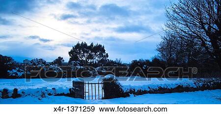 Garden gate and snow covered landscape, Clontarf, Dublin, Ireland. View Large Photo Image Stock Photo - Garden gate and snow covered landscape, Clontarf, Dublin, Ireland.. Fotosearch