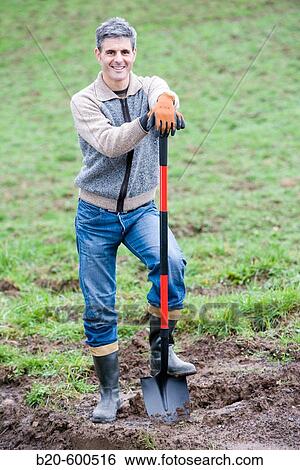 Gardener with shovel. Agricultural works. Gipuzkoa, Euskadi. Spain. View Large Photo Image Stock Photograph - Gardener with shovel. Agricultural works. Gipuzkoa, Euskadi. Spain.. Fotosearch
