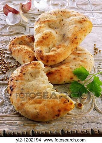 Garlic and coriander Indian Naan Bread View Large Photo Image Picture - Garlic and coriander Indian Naan Bread. Fotosearch