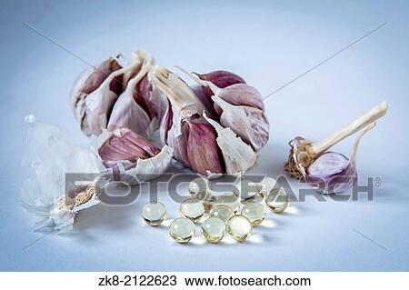 Garlic oil capsules, vitamin D pills. View Large Photo Image Stock Image - Garlic oil capsules, vitamin D pills.. Fotosearch