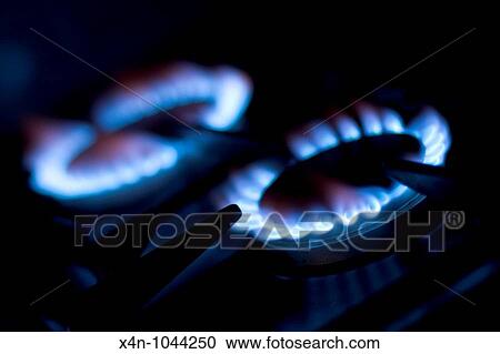 Stock Image - Gas rings on a hob. Fotosearch