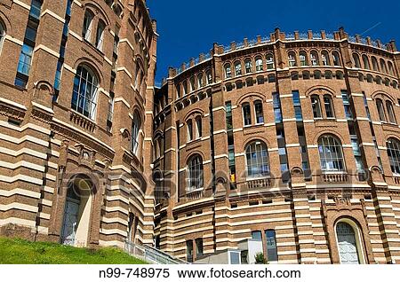 Gasometer City, former gas tank, restoration as mixed_use buiding, Simmering industrial area, Vienna, Austria View Large Photo Image Stock Photography - Gasometer City, former gas tank, restoration as mixed_use buiding, Simmering industrial area, Vienna, Austria. Fotosearch