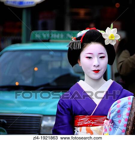 Stock Image - Geisha in a street of Kyoto. Japan, Honshu, Kinki, Kyoto, Gion. (/Julien Garcia). Fotosearch