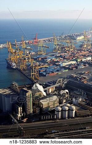Stock Image - General view of the industrial harbour from the top of the mountain of Montjuic, Barcelona, Catalonia, Spain. Fotosearch