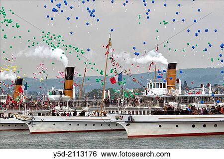 Stock Photograph - Geneva Lake close to Morges - historic steamboats parade - Parade Navale, Switzerland, Europe.. Fotosearch