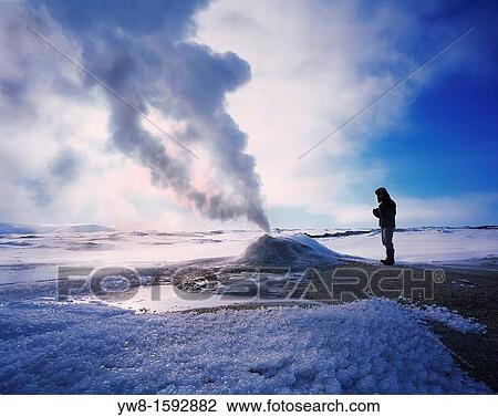 Stock Image - Geologist at Oskurholshver, hot spring at Hveravellir, Iceland. Fotosearch