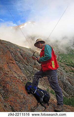 Geologist doing field work, Hudson Bay mountain, Smithers, British Columbia. View Large Photo Image Stock Photograph - Geologist doing field work, Hudson Bay mountain, Smithers, British Columbia.. Fotosearch