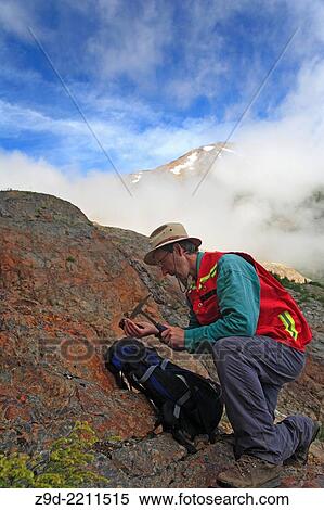 Geologist doing field work, Hudson Bay mountain, Smithers, British Columbia. View Large Photo Image Stock Photography - Geologist doing field work, Hudson Bay mountain, Smithers, British Columbia.. Fotosearch