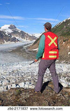 Geologist exploring for minerals, Salmon Glacier area, Stewart, British Columbia. View Large Photo Image Stock Photo - Geologist exploring for minerals, Salmon Glacier area, Stewart, British Columbia.. Fotosearch