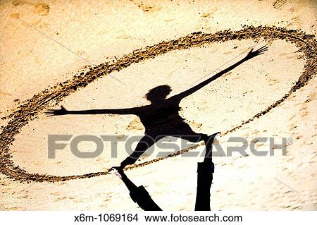 Picture - geometrical figure with sand and shadow. Fotosearch