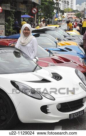 Picture - George Town, Penang (Malaysia): Muslim girl at a cars expo. Fotosearch