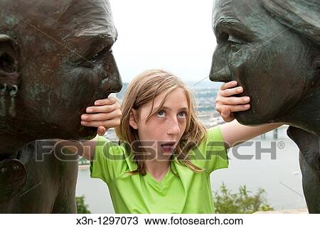 Stock Image - George Washington and Indian statues in Pittsburgh, PA, Girl between statues. Fotosearch