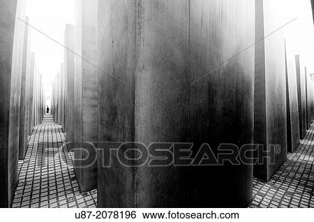 Germany, Berlin, Memorial to the Murdered Jews of Europe, Concrete Pillars of the Holocaust Memorial, designed by Architect Peter Eisenman and engineer Buro Happold. View Large Photo Image Stock Photograph - Germany, Berlin, Memorial to the Murdered Jews of Europe, Concrete Pillars of the Holocaust Memorial, designed by Architect Peter Eisenman and engineer Buro Happold.. Fotosearch