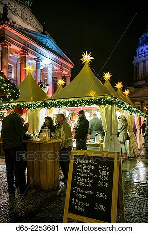 Stock Image - Germany, Berlin, Mitte, Gendarmenmarkt, Christmas market, outdoor food shop.. Fotosearch