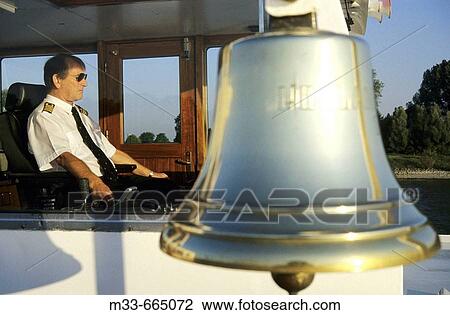 Germany - Cruise down the Rhine river. Captain of the Rhine Emerald boat. View Large Photo Image Stock Image - Germany - Cruise down the Rhine river. Captain of the Rhine Emerald boat.. Fotosearch