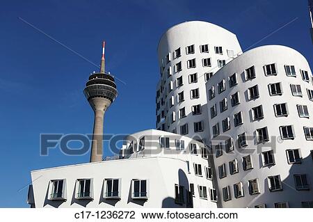 Stock Image - Germany, Duesseldorf, Rhine, Lower Rhine, North Rhine-Westphalia, NRW, Rhine tower Lang Wellem, television tower, observation tower, restaurant, architect Harald Deilmann, Gehry buildings, Neuer Zollhof, architect Frank Gehry. Fotosearch
