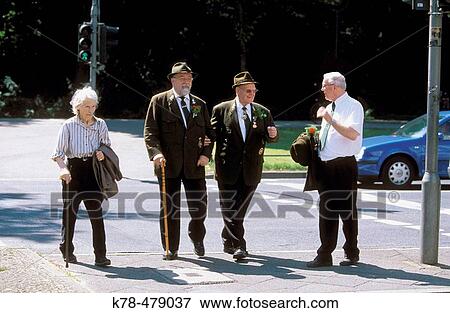 Germany, North Rhine Westphalia, Cologne. Senior people walking in central cologne. View Large Photo Image Stock Photo - Germany, North Rhine Westphalia, Cologne. Senior people walking in central cologne.. Fotosearch