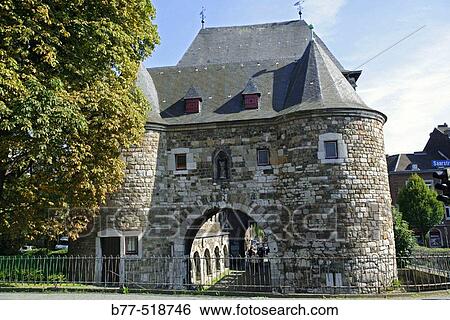 Stock Photograph - Germany, North Rhine-Westphalia, Aachen, Ponttor with Heilig-Kreuz-Church. Pont Gate was part of the historical city fortifications and was built around the 1300th.. Fotosearch