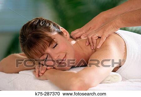 Getting a massage at a spa View Large Photo Image Stock Image - Getting a massage at a spa. Fotosearch