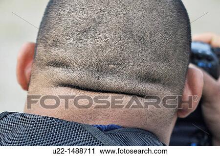 Stock Image - Ginowan (Japan): the fat nape of an American photographer. Fotosearch