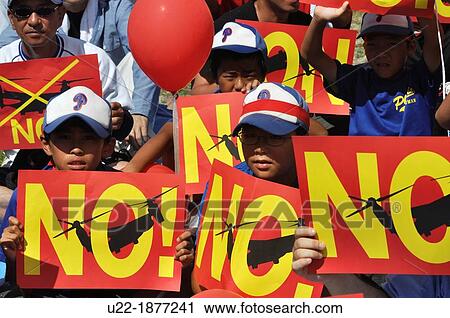 Stock Image - Ginowan, Okinawa, Japan, people protesting against the American military occupation of Okinawa and the use of V-22 Osprey helicopters. Fotosearch