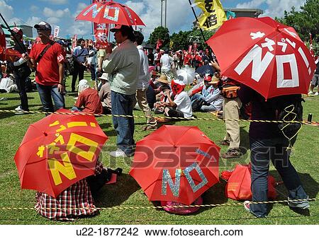 Ginowan, Okinawa, Japan, people protesting against the American military occupation of Okinawa and the use of V-22 Osprey helicopters View Large Photo Image Stock Image - Ginowan, Okinawa, Japan, people protesting against the American military occupation of Okinawa and the use of V-22 Osprey helicopters. Fotosearch
