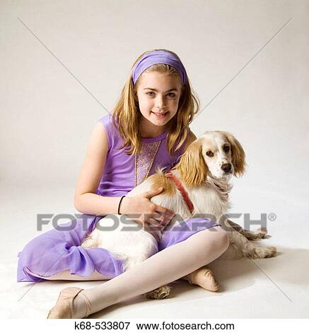 Stock Photo - girl, 10, with spaniel. Fotosearch