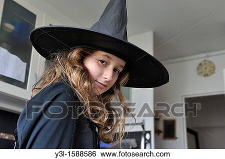 Girl 11 disguiseed as witch on Halloween day, in kitchen View Large Photo Image Stock Photograph - Girl 11 disguiseed as witch on Halloween day, in kitchen. Fotosearch