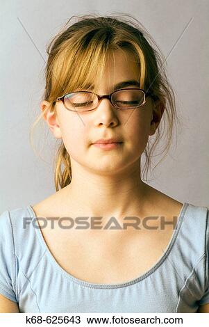 Stock Image - girl, 11, eyes closed. model release. Fotosearch