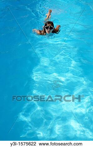 Girl 11 with goggles in swimming pool, Provence, France View Large Photo Image Stock Image - Girl 11 with goggles in swimming pool, Provence, France. Fotosearch